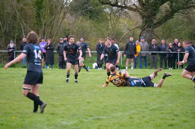 Flanker Owain Evans puts in a strong tackle. Picture William John